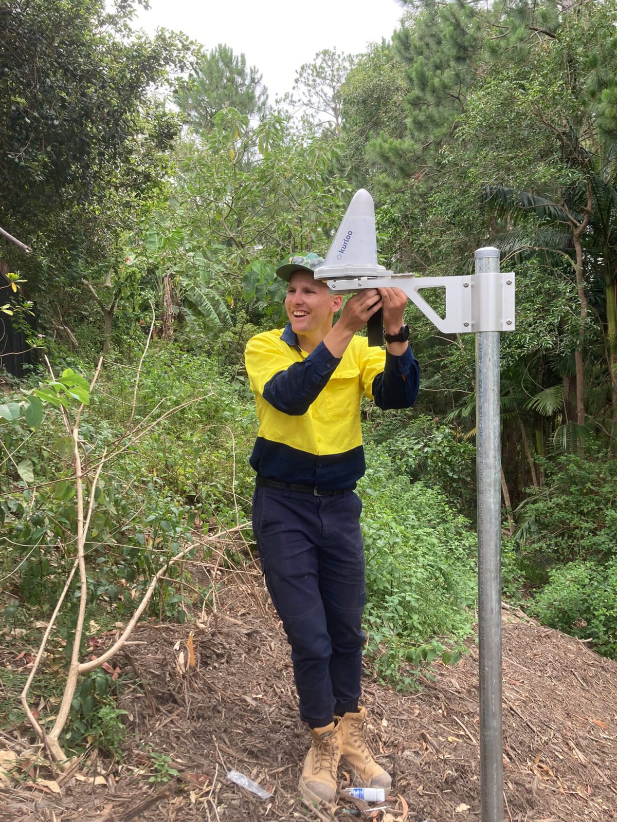 Kurloo worker installing Kurloo device